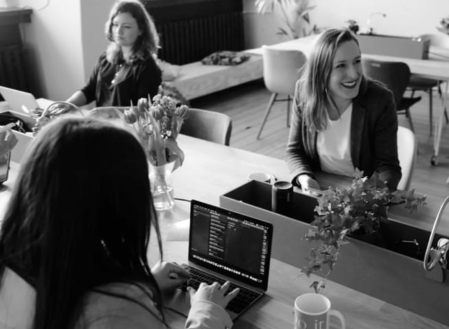 A group of people working at their desks